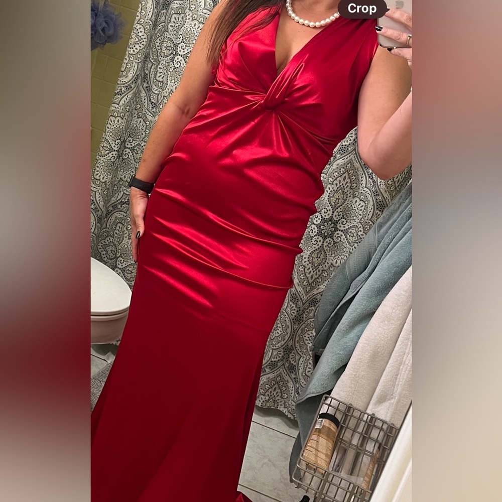 Worn once for one event. Very bright red. It’s been taken in at the shoulders